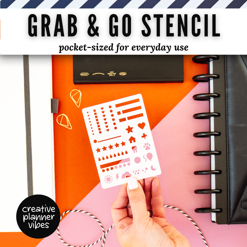 Hand holding the Grab & Go pocket-sized planner stencil over a disc-bound planner